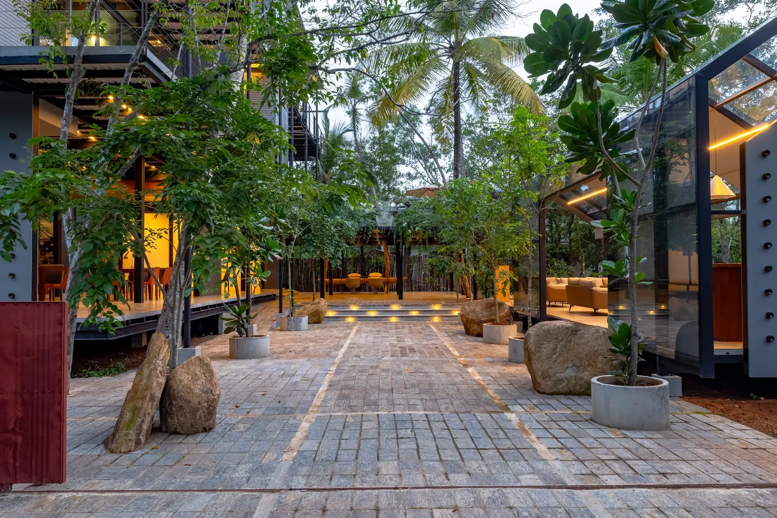 Architectural exterior of BlackRoots showing elevated design and tropical planting