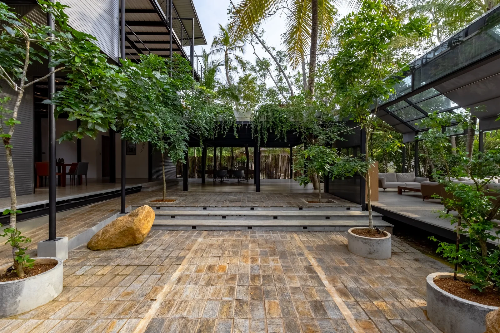 Contemporary entrance architecture framed by calm wetland planting