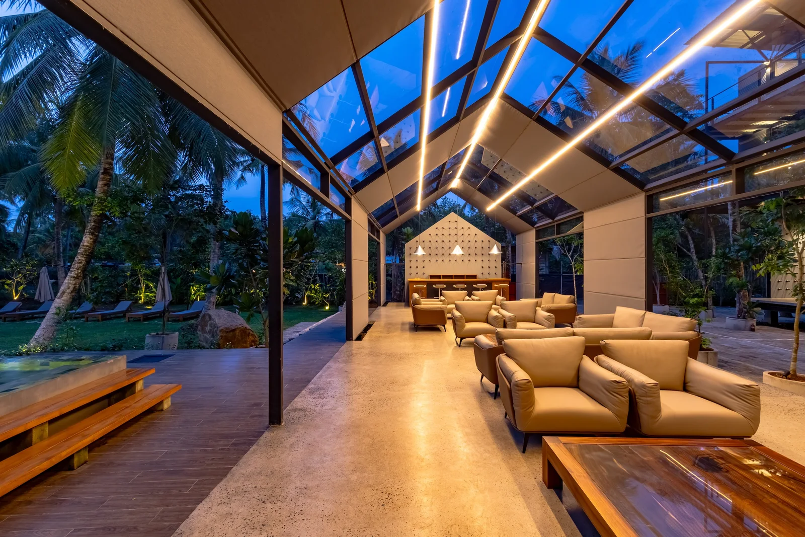 Refined boutique interior moment with greenery and architectural light